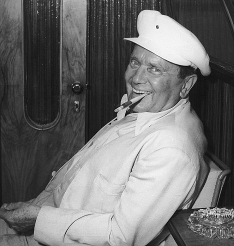 circa 1960: Yugoslav President Josip Broz Tito (1892 - 1980) sitting in a cabin on a chair against the wall, smiling and smoking a cigarette with a long filter. (Photo by Hulton Archive/Getty Images)