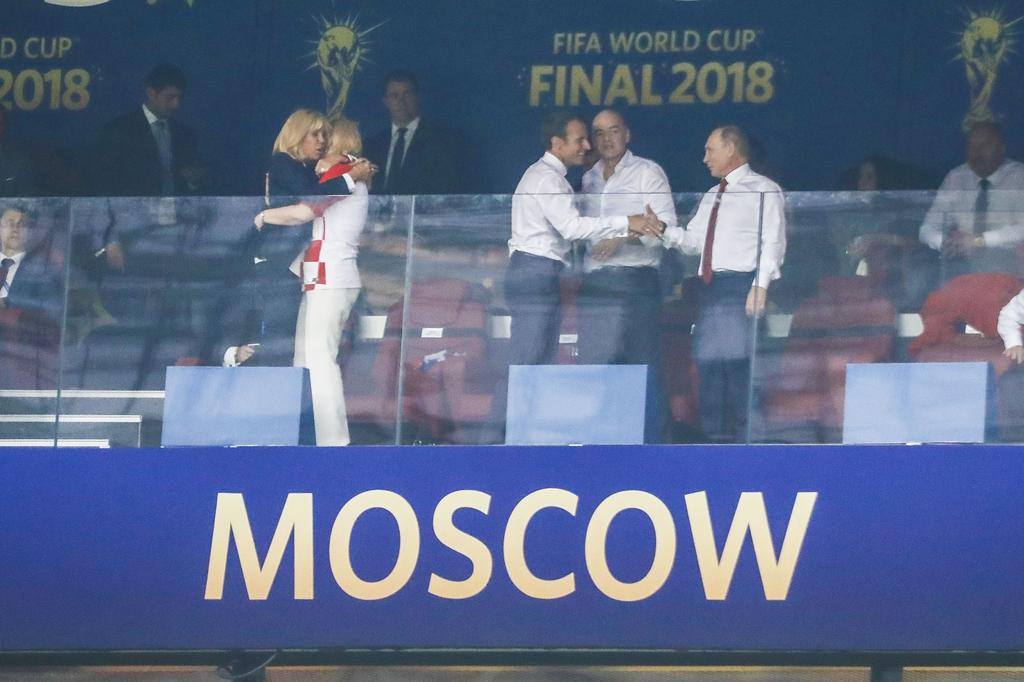 Russia's president Vladimir Poutines congratulates France's President Emmanuel Macron and Brigitte Macron consulates Kolinda Grabar-Kitarovic after Paul Pogba scored the 3-1 goal during the 2018 FIFA World Cup Russia Final game, France vs Croatia In Luzhniki Stadium, Moscow, Russia on July 15th, 2018. France won 4-2. Photo by Henri Szwarc/ABACAPRESS.COM | 644634_001 Moscou Russie Russia